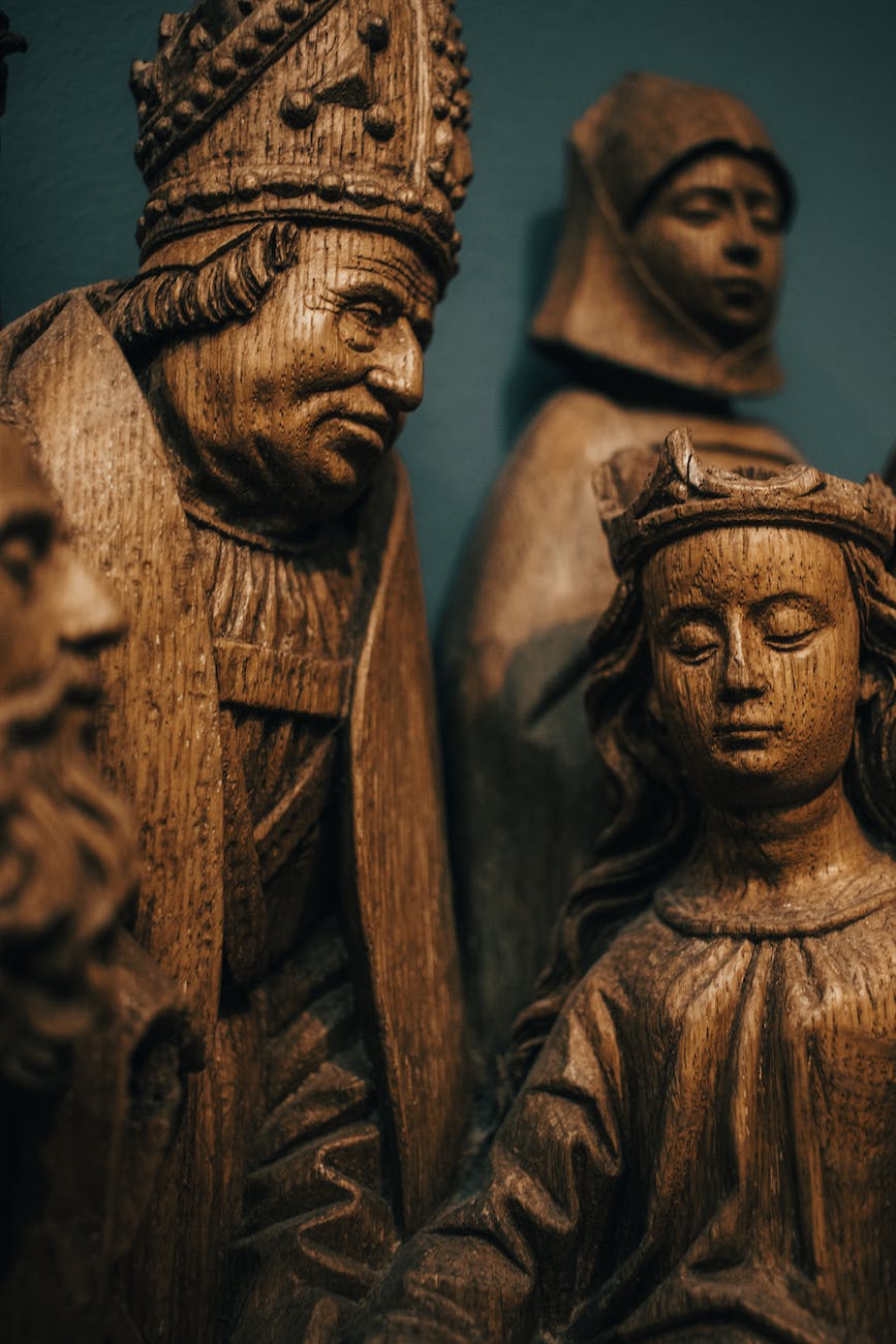 sculpture of a bishop and a child